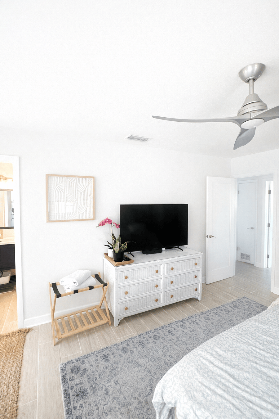 Master suite with smart TV, ceiling fan, and bright, airy design. A comfortable retreat to relax and unwind at the end of the day.