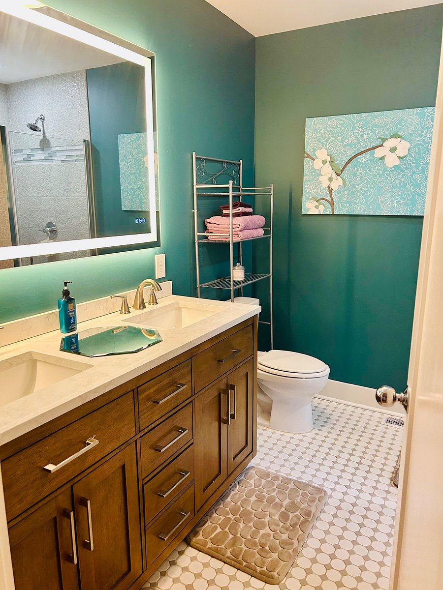 The Garden Suite's private bath features a dual vanity and dual showers, perfect for getting ready with ease or unwinding after a long day.