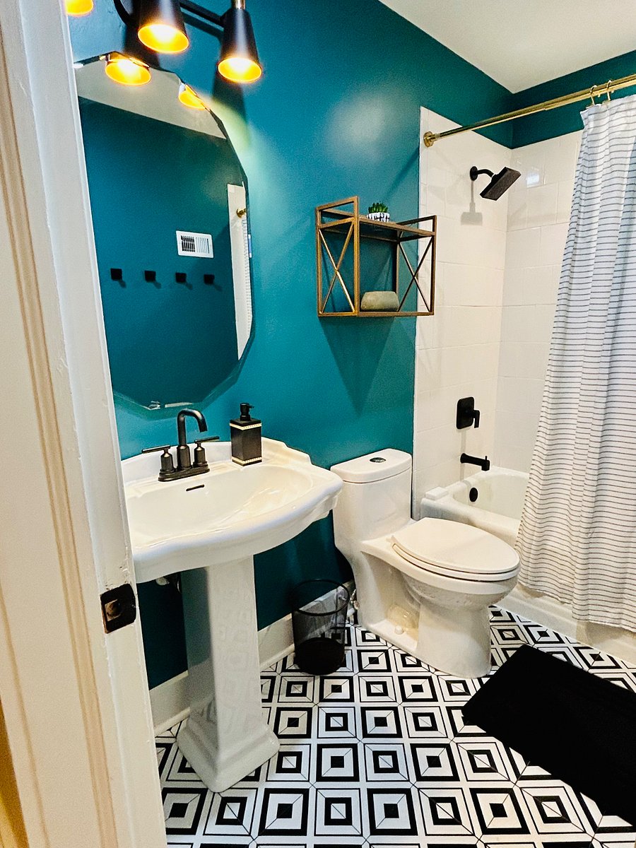 Hallway bath features thoughtful touches making it ideal for shared use.
