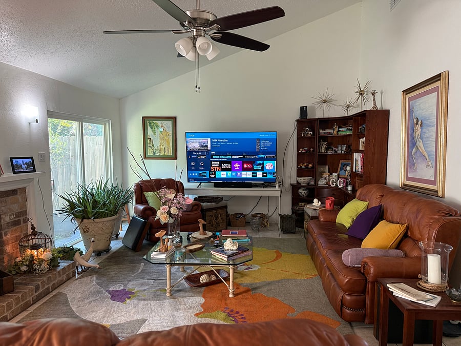 Shared living area with Samsung Smart TV and multiple seating options for everyday relaxation and entertainment