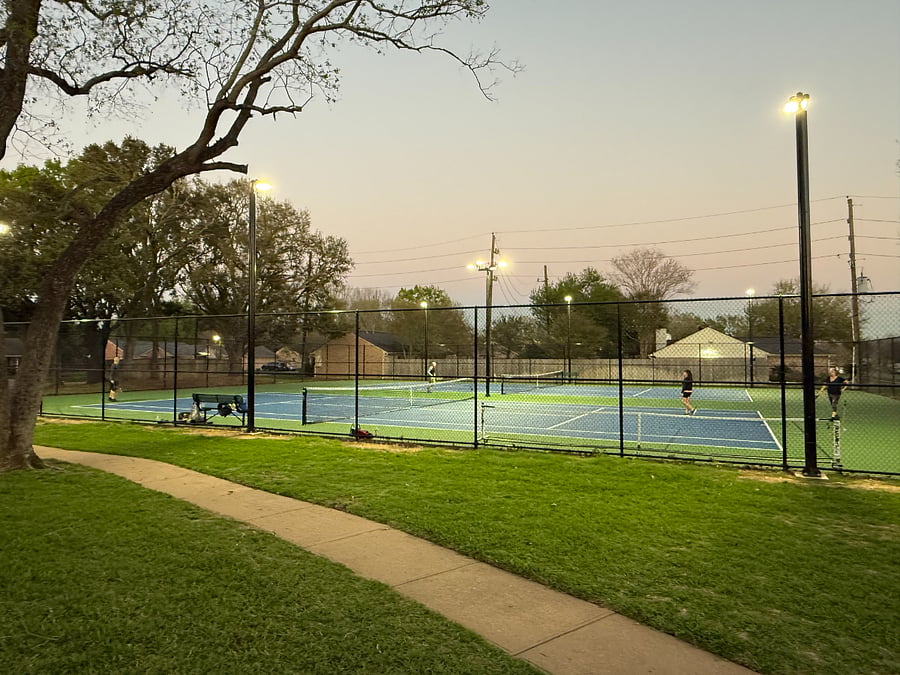 Well-maintained recreational courts and outdoor amenities available nearby.