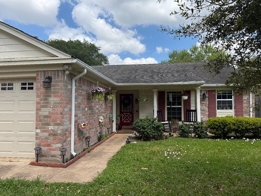 Peaceful and well-kept sidewalk leading to a quiet home in the First Colony neighborhood.