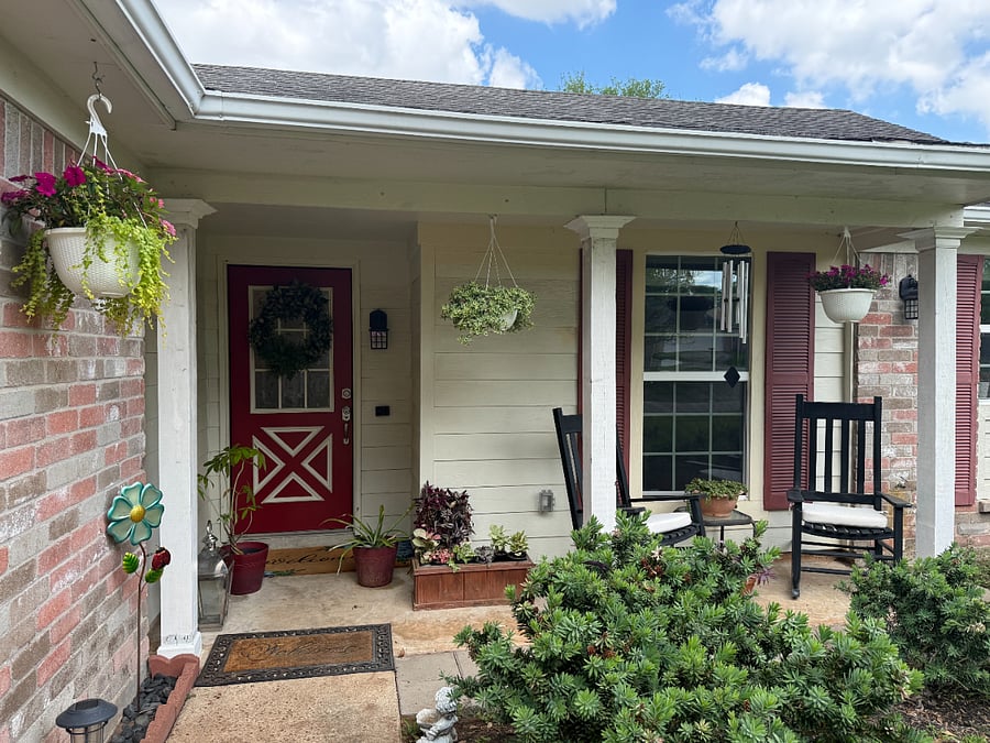 Inviting front porch with a calm and welcoming entry to the home.
