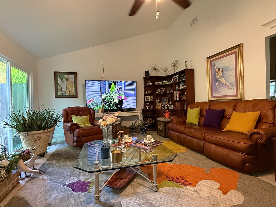 Spacious shared living area with Smart TV and comfortable seating.