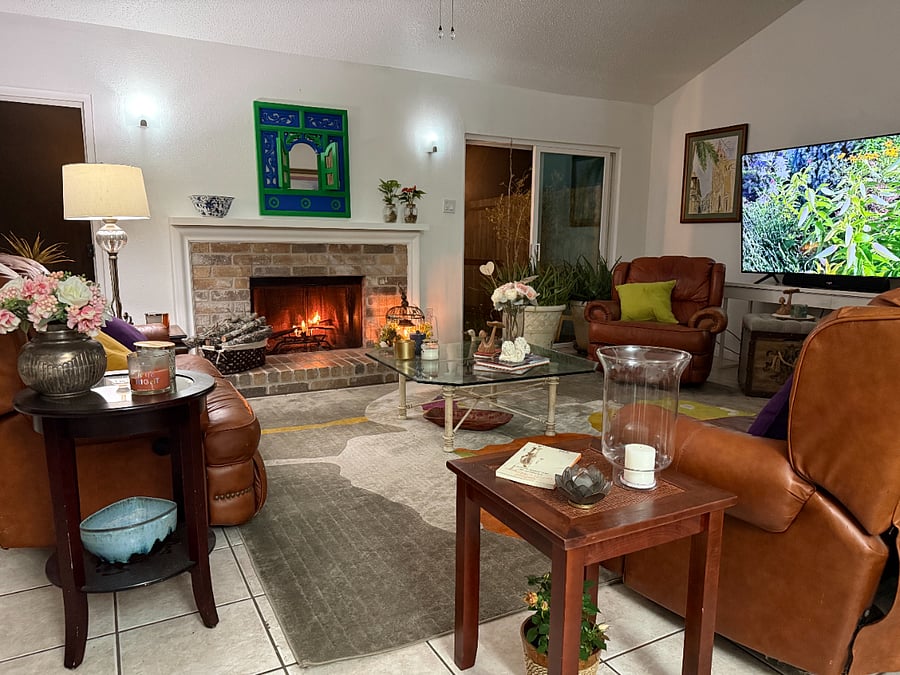 Comfortable shared family room with fireplace and a cozy seating area.