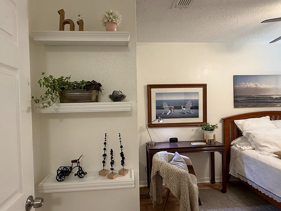 Bright and cozy room with queen-size bed, workspace, and upgraded mirrored closet doors.