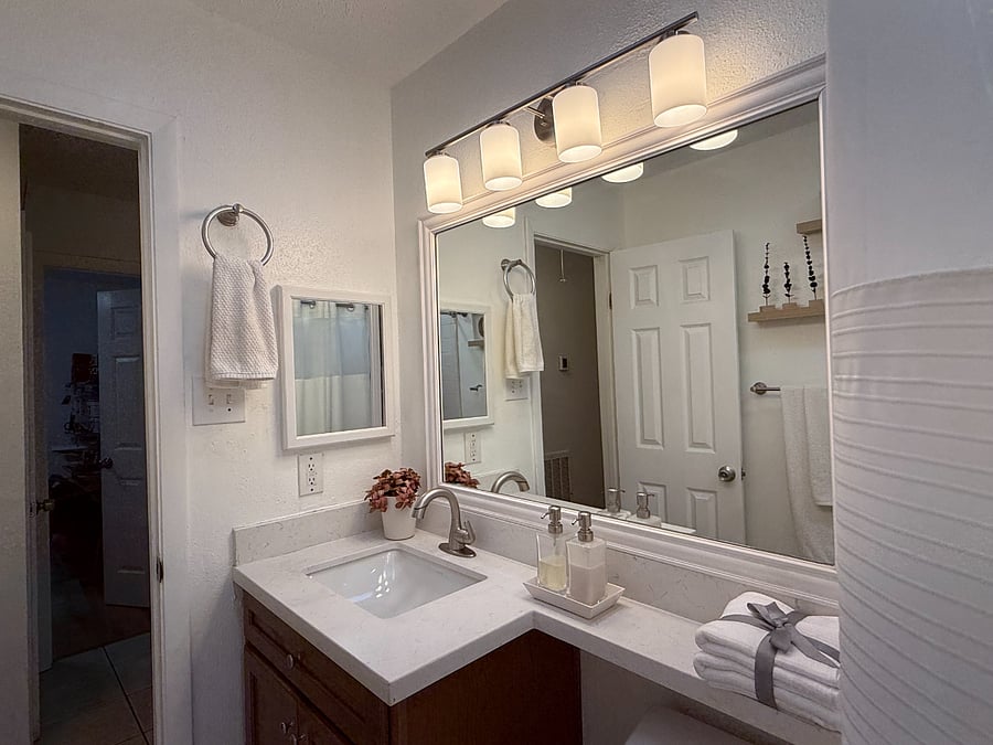 Exclusive-use bathroom for the resident, fully stocked with towels, hand soap, shampoo, hand lotion, bath mat, and bathroom essentials.