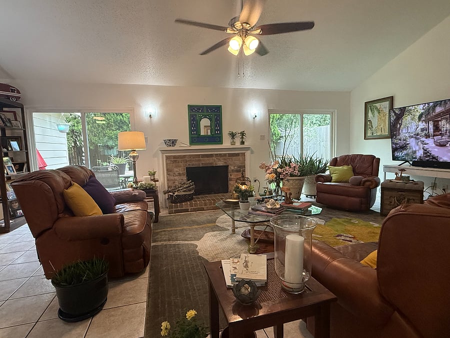 Comfortable shared family room with natural light and Smart TV.