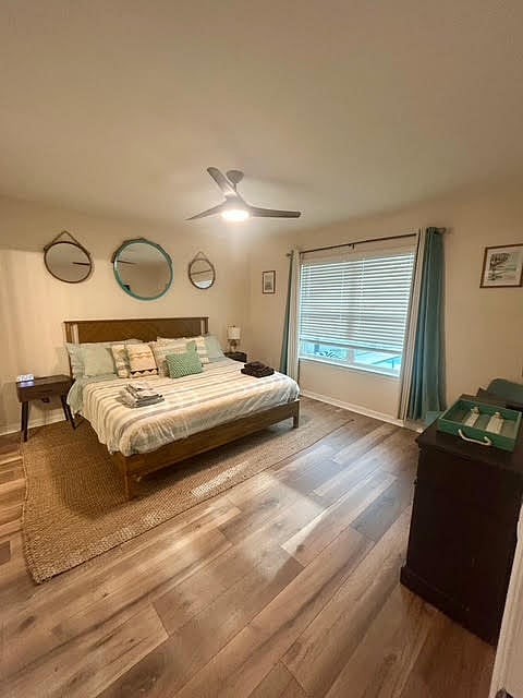 Primary Bedroom:
King Bed, window overlooks the pool