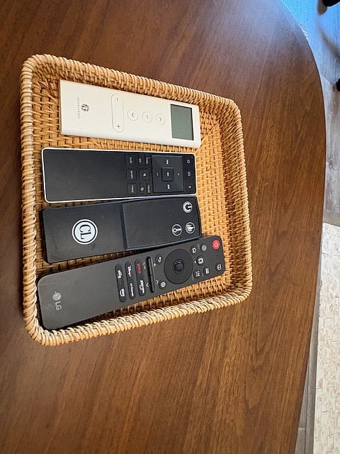 Remotes for TV, Sound Bar, Roller Shades and Fireplace.