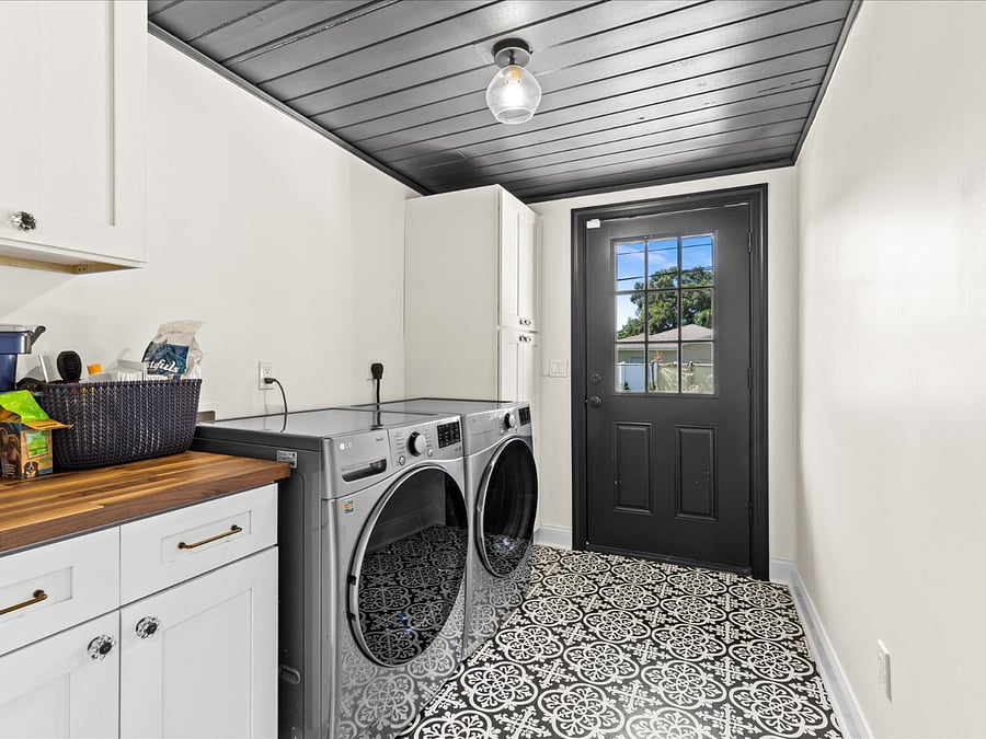 dedicated laundry room / mud room with extra storage and access to the back yard. Home comes with beach towels and beach chairs.