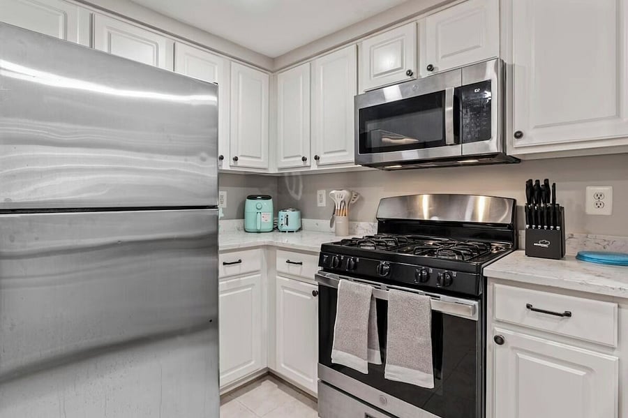 Fully stocked kitchen, with air fryer, toaster, blender, Keurig coffee maker