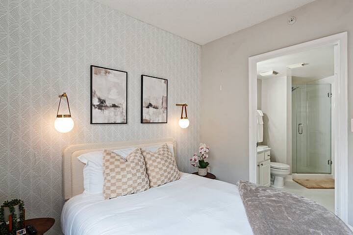 memory foam Bed, wall mounted light sconces, smart TV, linen, walk in closet, attached full bathroom