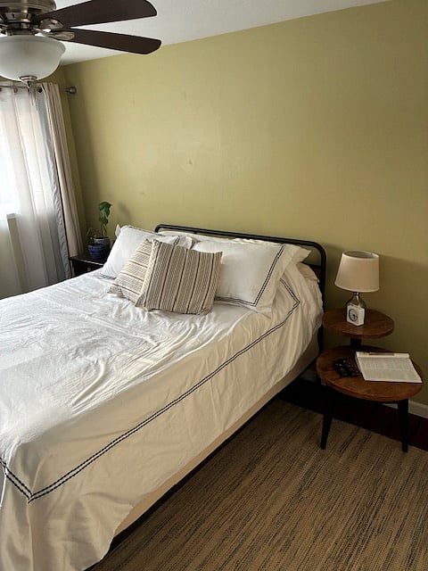 queen bed on the west side of the house and wall mounted smart TV, all bedding is either all cotton or all linen.  