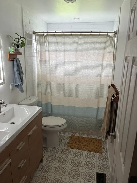 full bathroom with double vanity