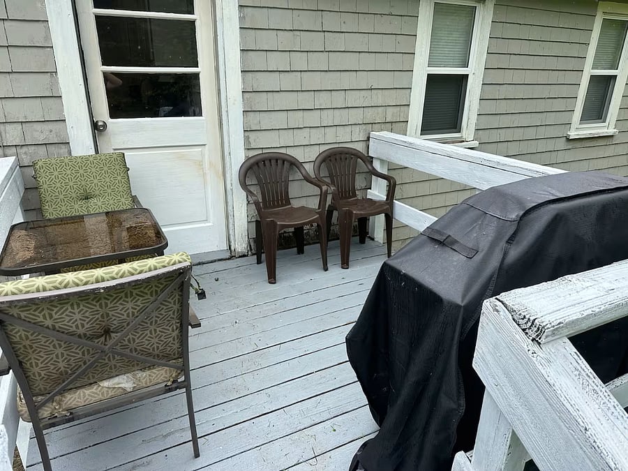 Deck with outdoor seating and grill.
