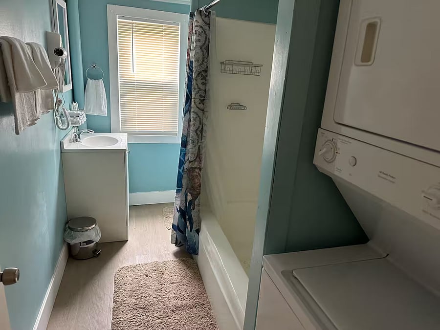 Full bathroom with washer and dryer included.