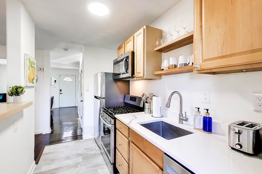 Fully stocked kitchen with all new appliances, including new wine glasses and fun coffee mugs!