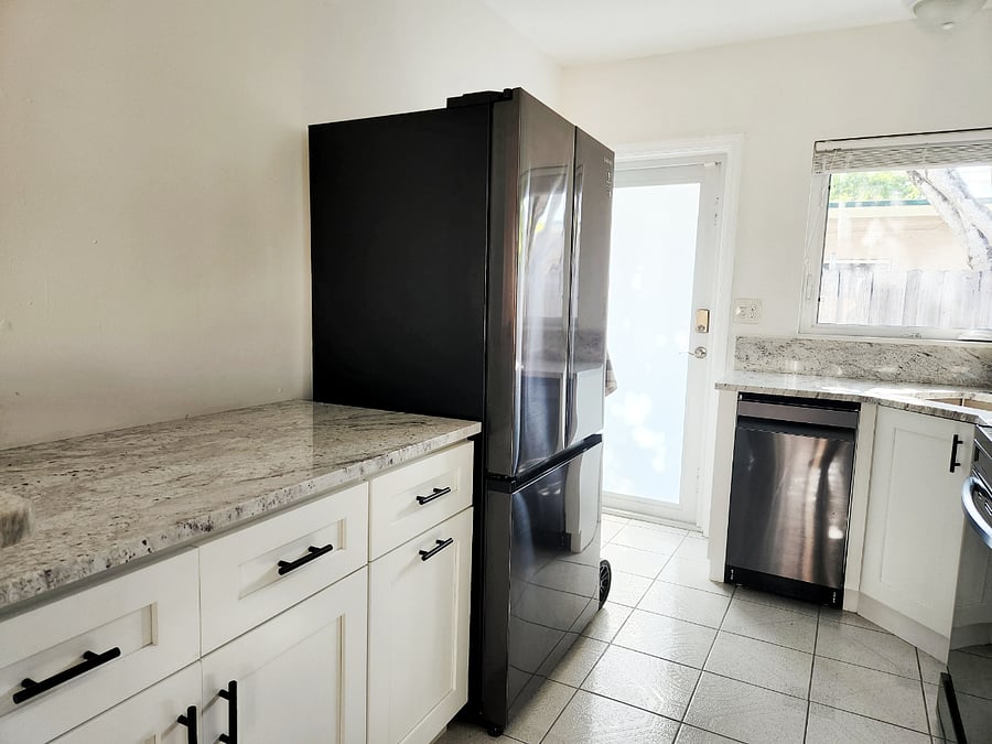 Kitchen with dishwasher and full size refrigerator