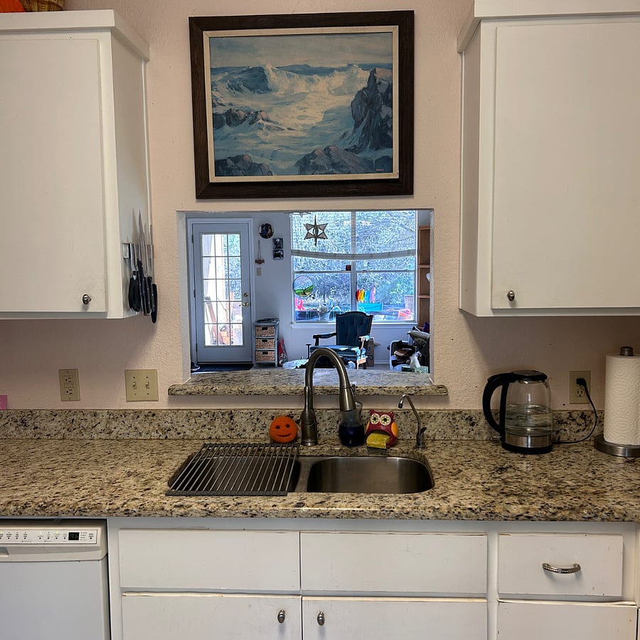 Kitchen has a lovely passthrough to the living room/dining table