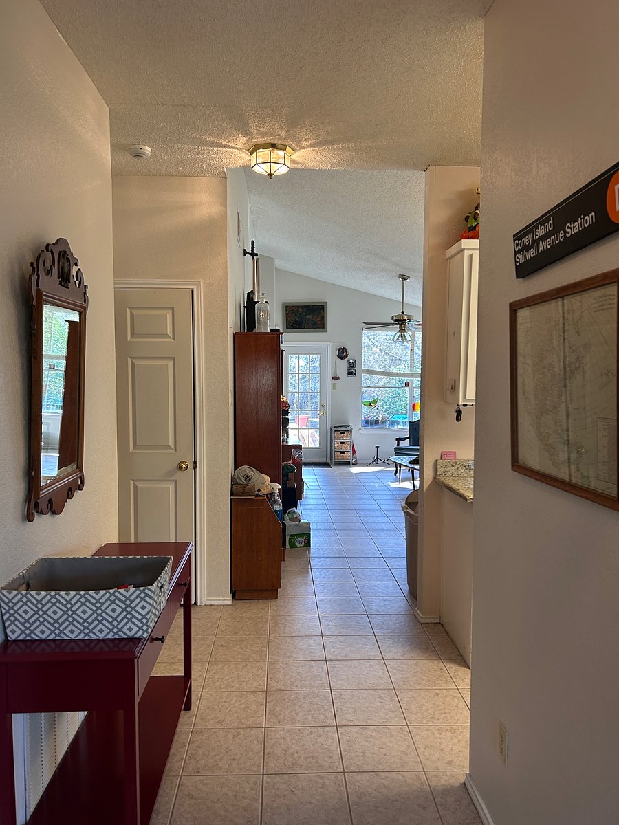 Entrance hall toward living room, kitchen on the right
