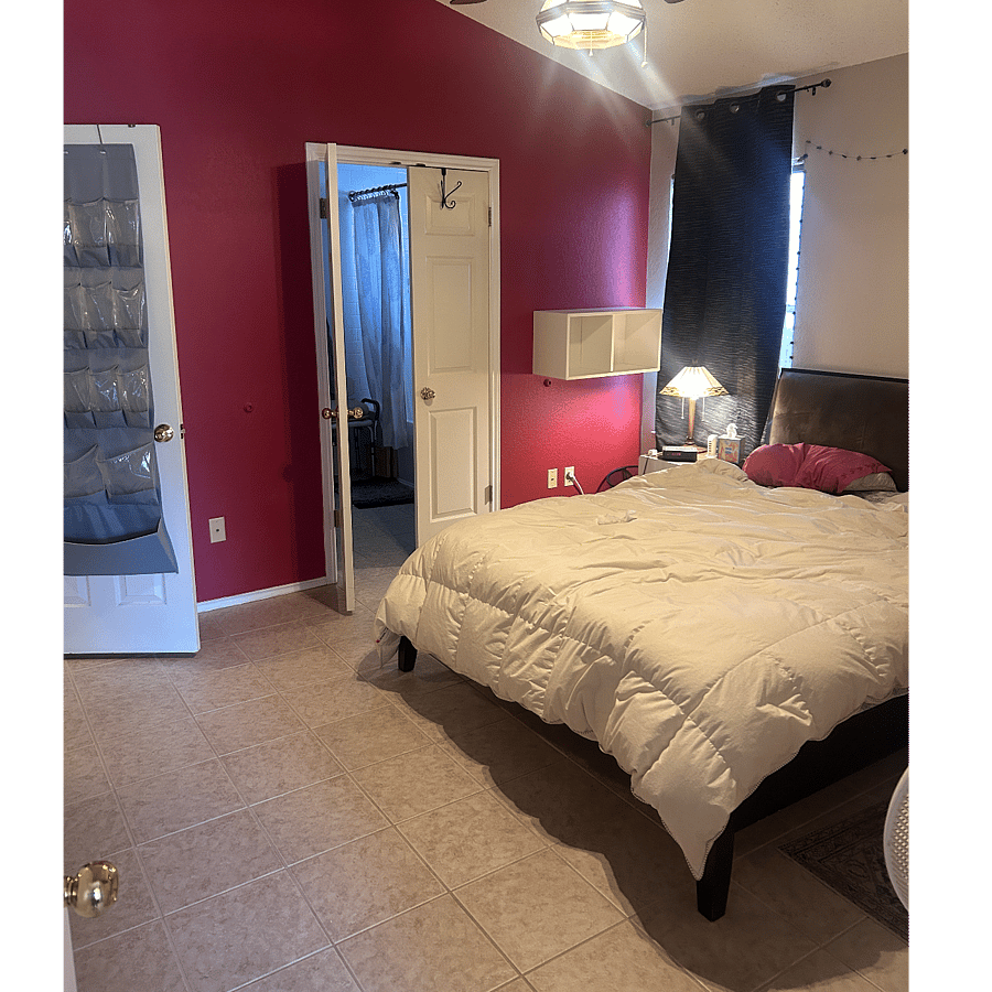 Primary bedroom with queen bed, plenty of storage space