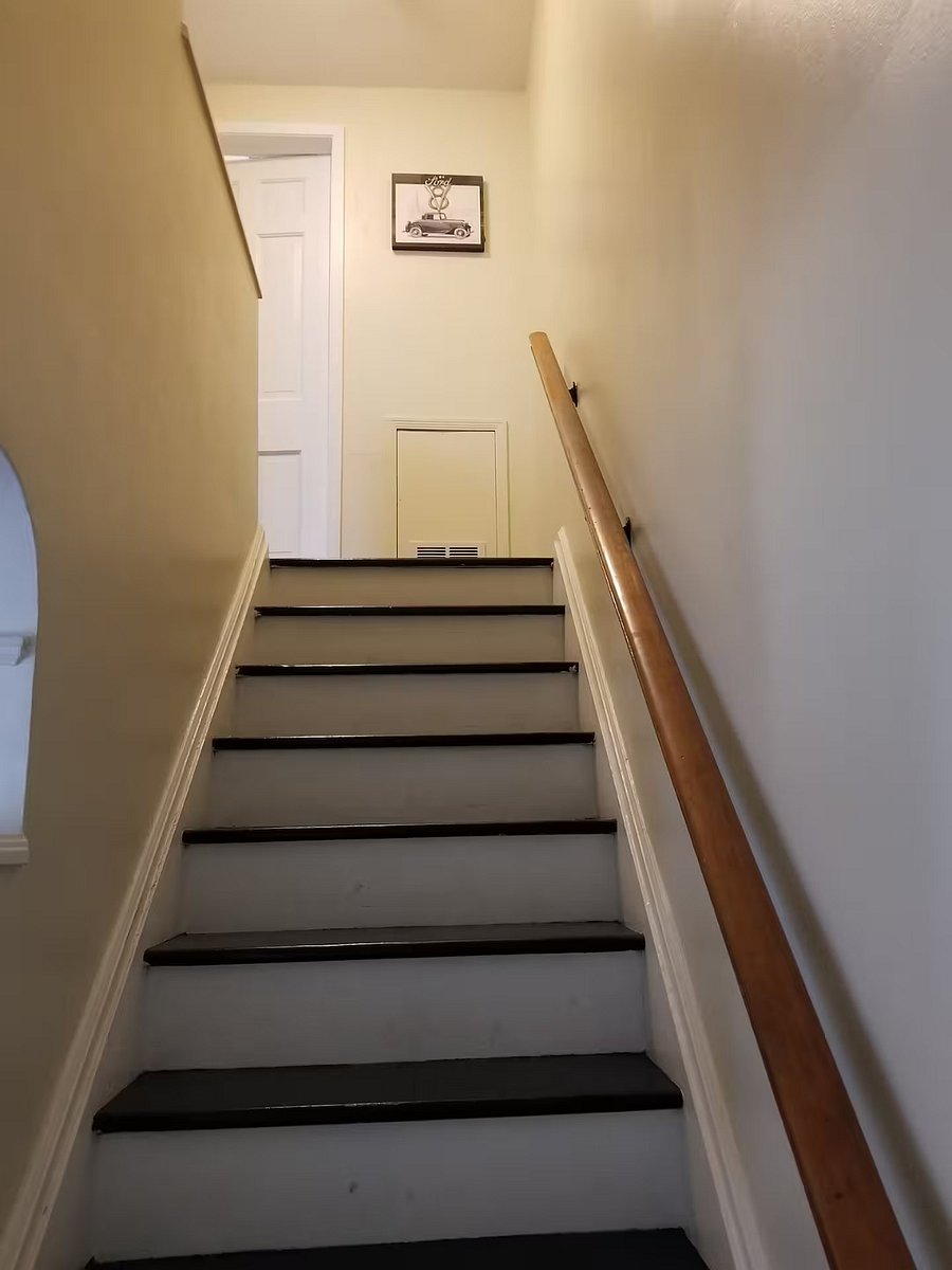 Stairs leading to the upstairs 2 bedrooms and bathroom