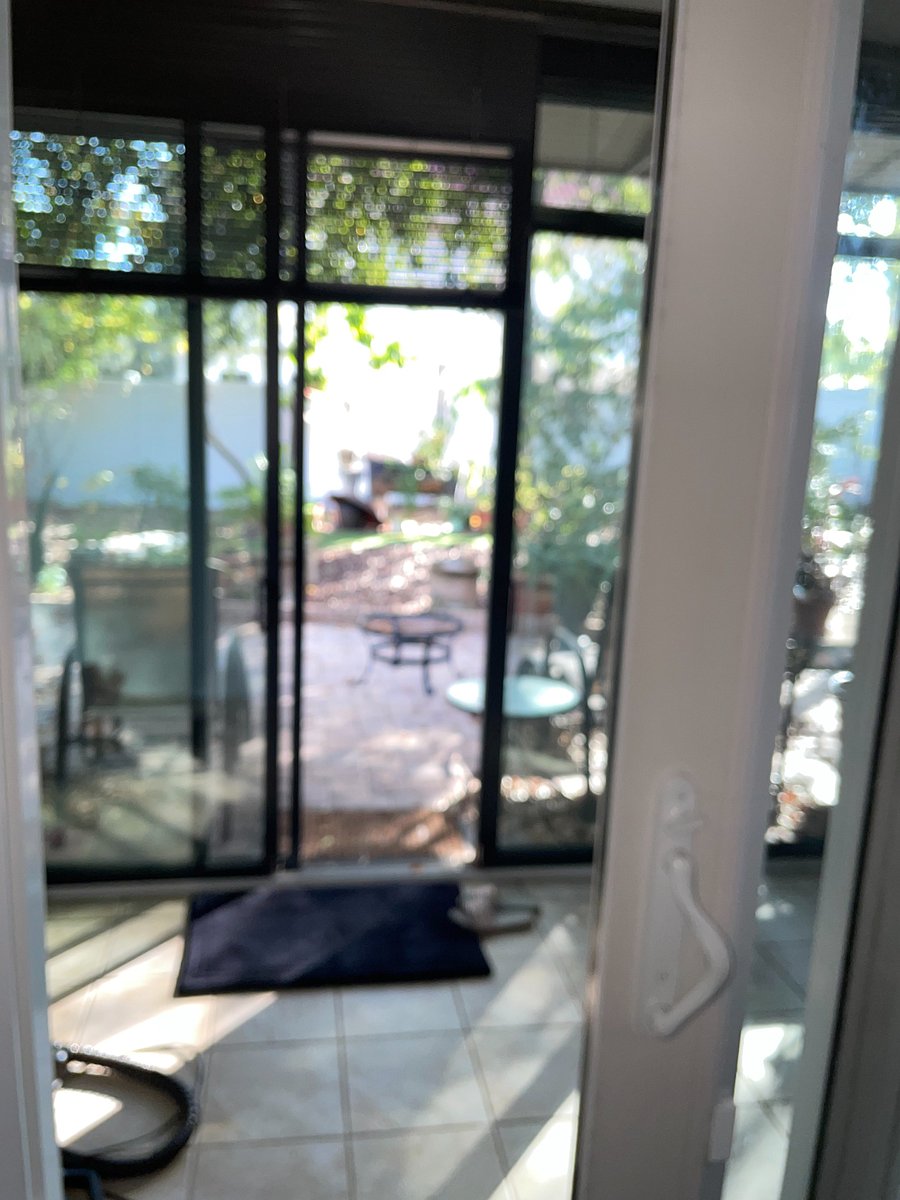 Patio tiled, comfortable work space. 
Walk out onto a paved area with  seating and fire pit. 