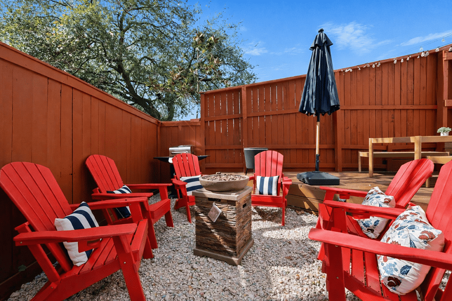 Outdoor oasis with firepit, grill, outdoor dinning space and games