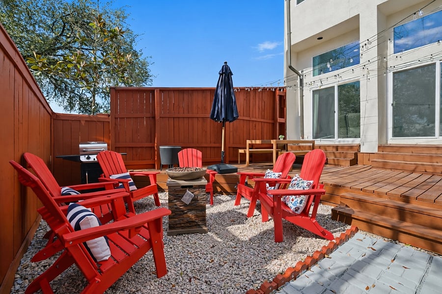 Outdoor oasis with firepit, grill, outdoor dinning space and games