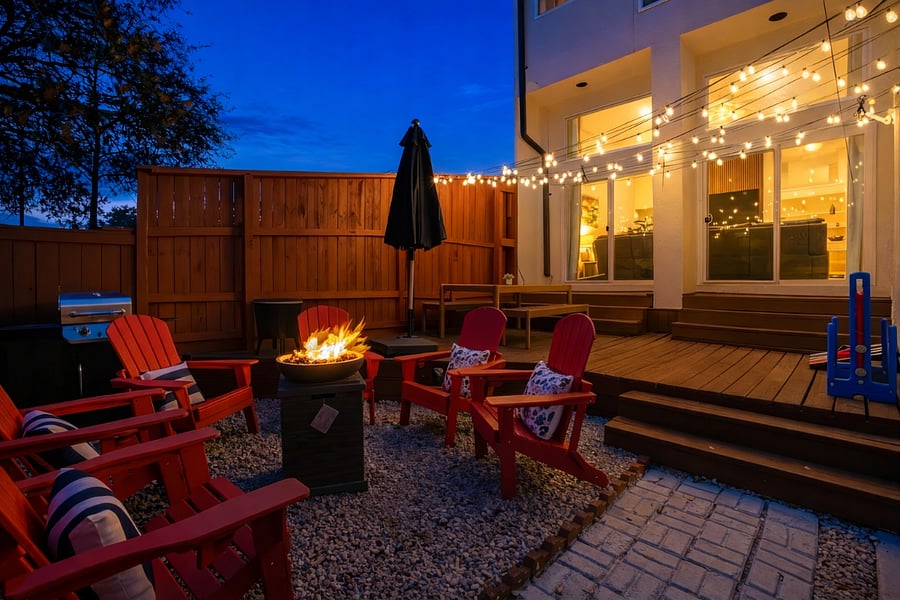 Outdoor oasis with firepit, grill, outdoor dinning space and games
