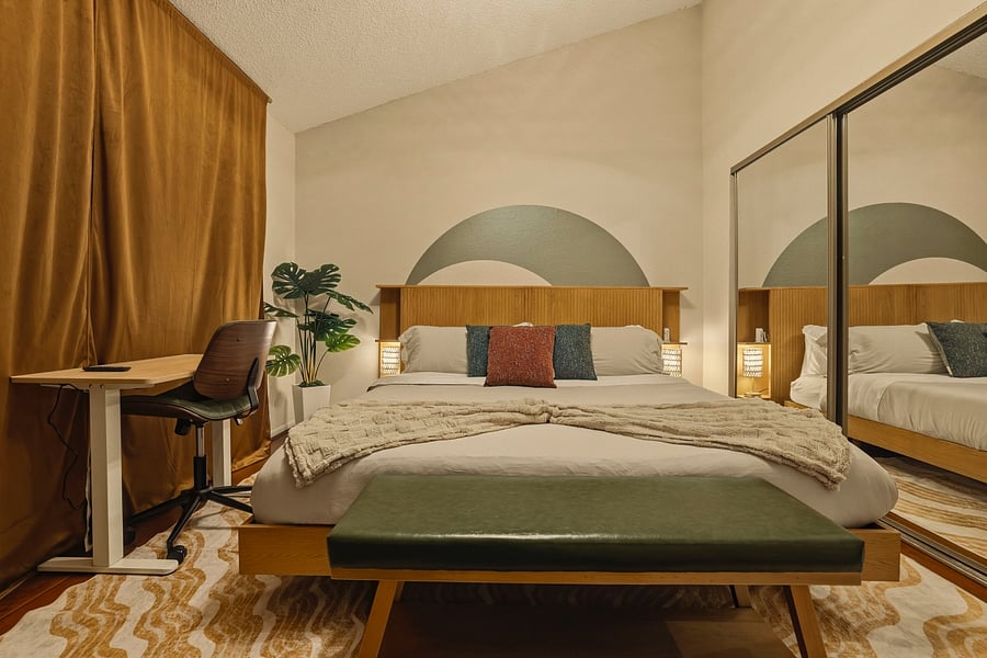 3rd Bedroom: King, 43 Smart TV, closet and private Balcony access. Dedicated office space with standing desk and ethernet access