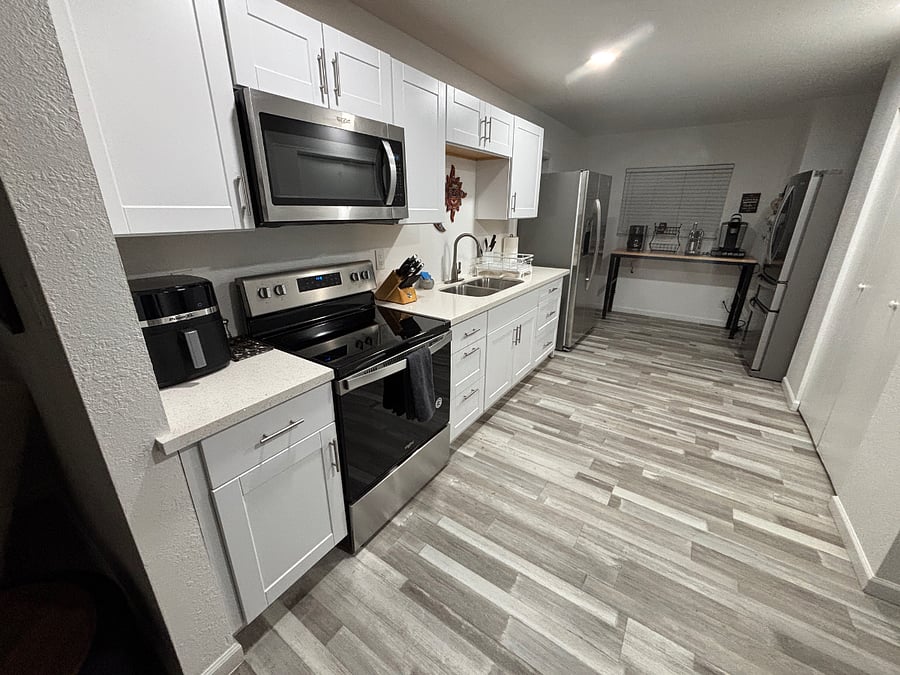 Fully stocked kitchen with coffee bar accessories and 2 refrigerators.  Shelves in fridges and pantry assigned to each suite.