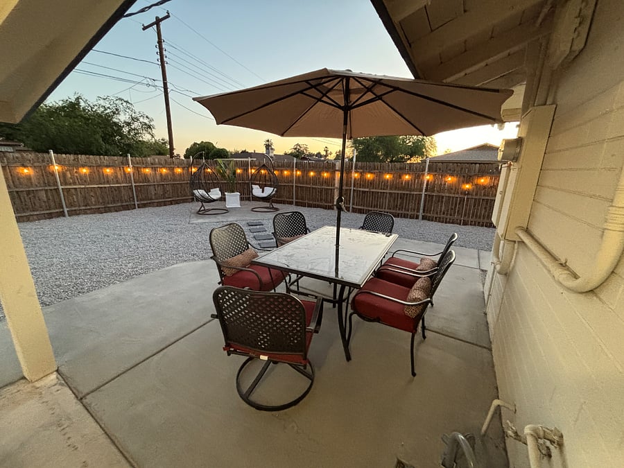 Backyard patio table with seating for 6.