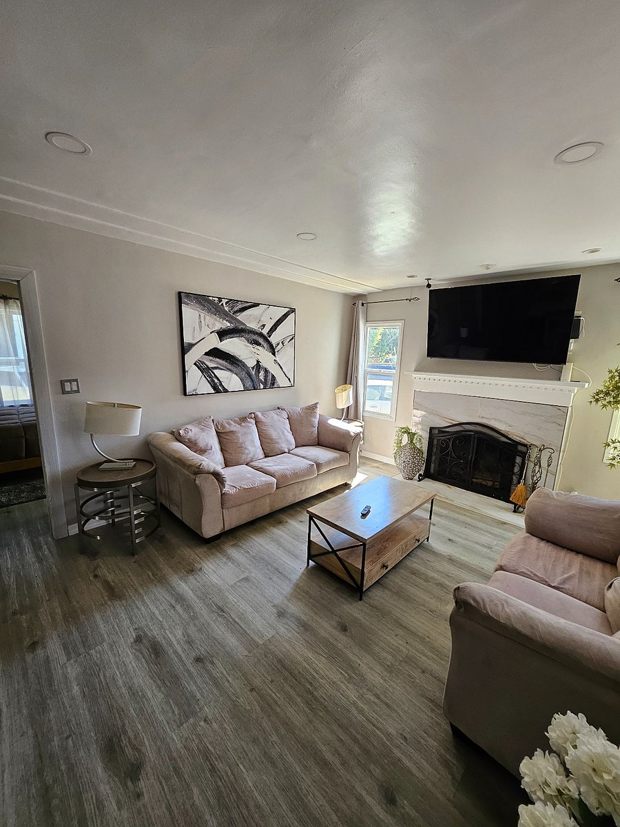 Lvrm beautiful marble wood burning fireplace and 75" smart TV