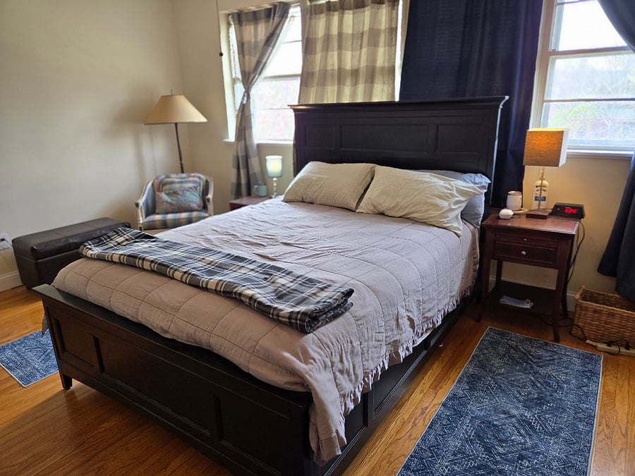 MASTER SUITE ($1100) has queen bed, private bathroom with shower, walk-in closet, workstation, blackout curtains, dresser, shelves, full-length mirror, nightstands, armchair. Recently painted. 16 ft 8" X 11 ft 6" (circa 190 sq feet)
