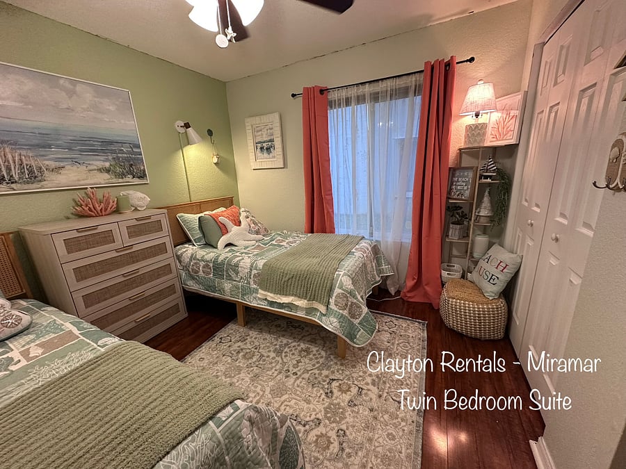 Twin Bedroom Suite includes two beds and blackout curtains. It has a full closet and a mounted adjustable TV.
