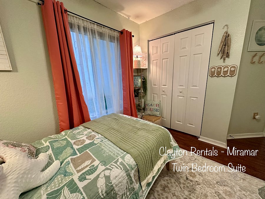 Twin Bedroom Suite includes two beds and blackout curtains. It has a full closet and a mounted adjustable TV.