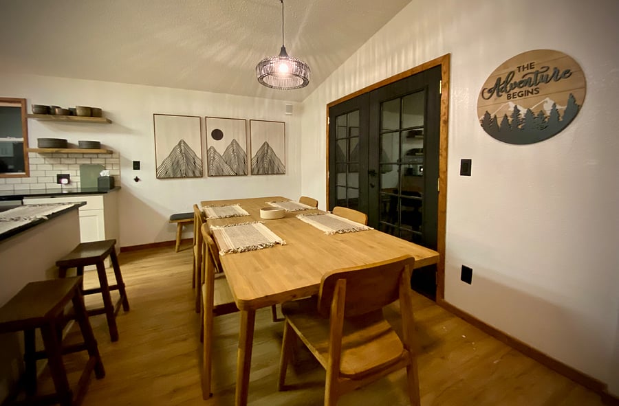Dining room & double doors to wraparound deck & BBQ.