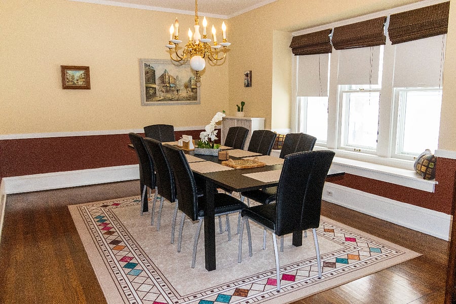 The dining room comfortably seats 8, making it perfect for family meals, gatherings with friends, or cozy dinners at home. Its warm, inviting atmosphere encourages long conversations and shared moments.
