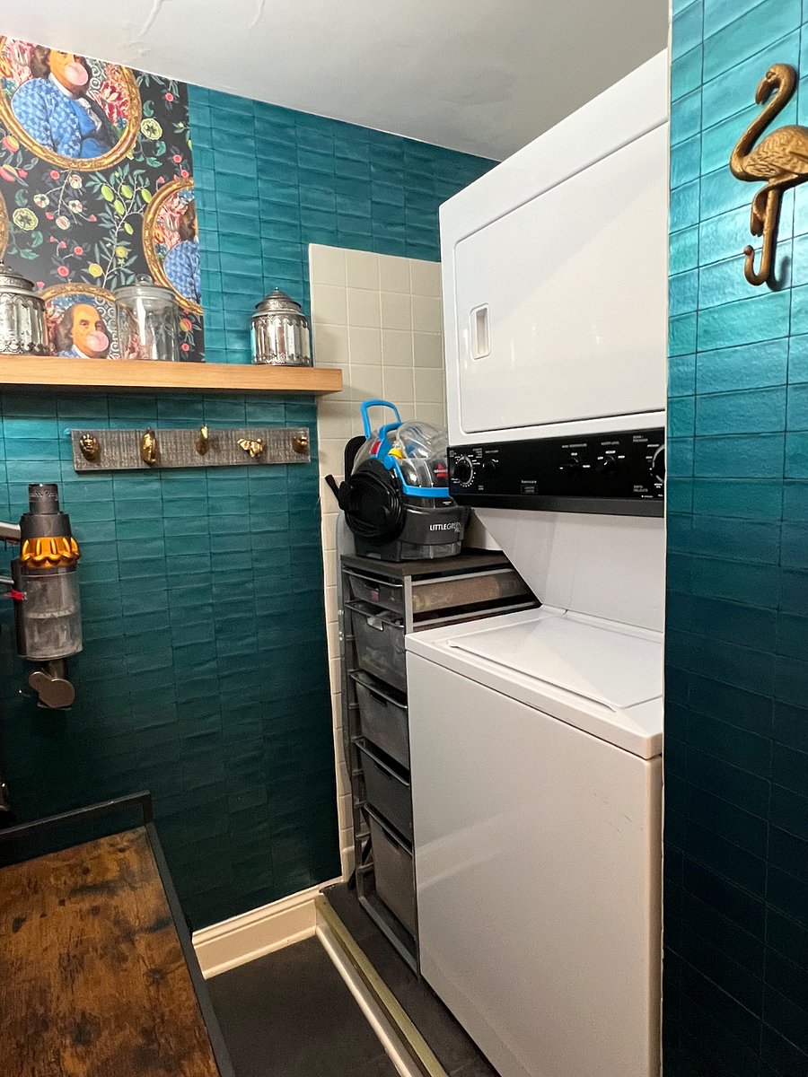 Full size washer and dryer with coat room.
