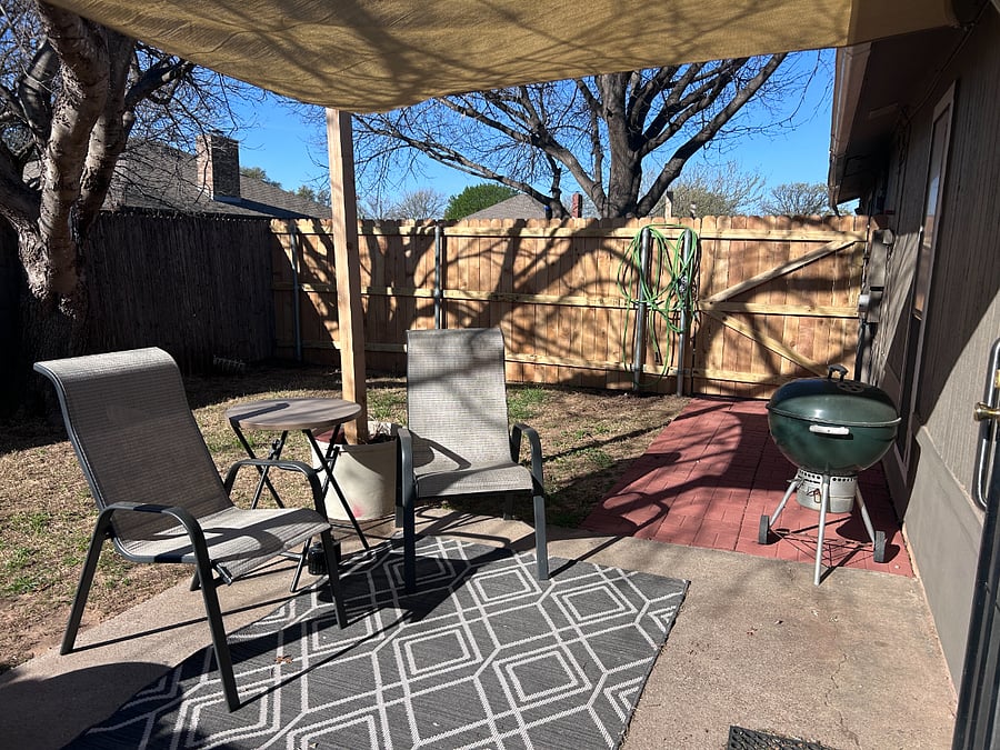 Backyard is small and lawn is maintained by owner.  There are two chairs, a rug, sunshade and table for you to enjoy outside.  Flowers will be planted in spring by owner.