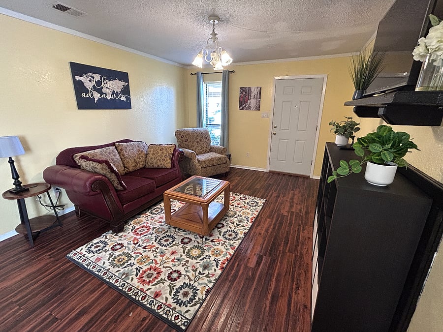 Living Room with front door visible on right side.B