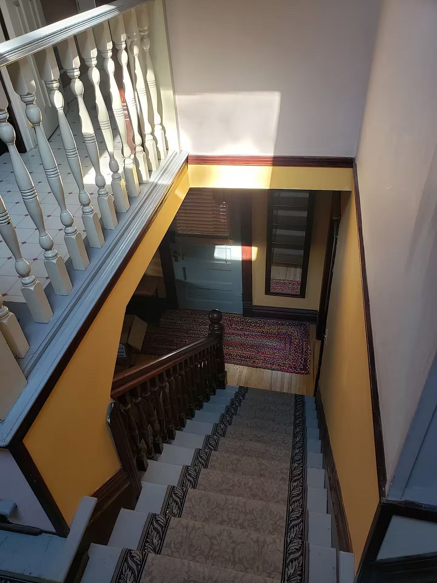 Stairs leading down to living room