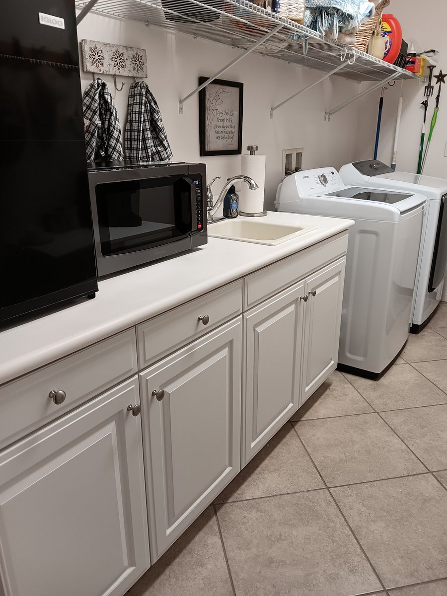 Kitchenette with refrigerator,  microwave, and coffee maker.