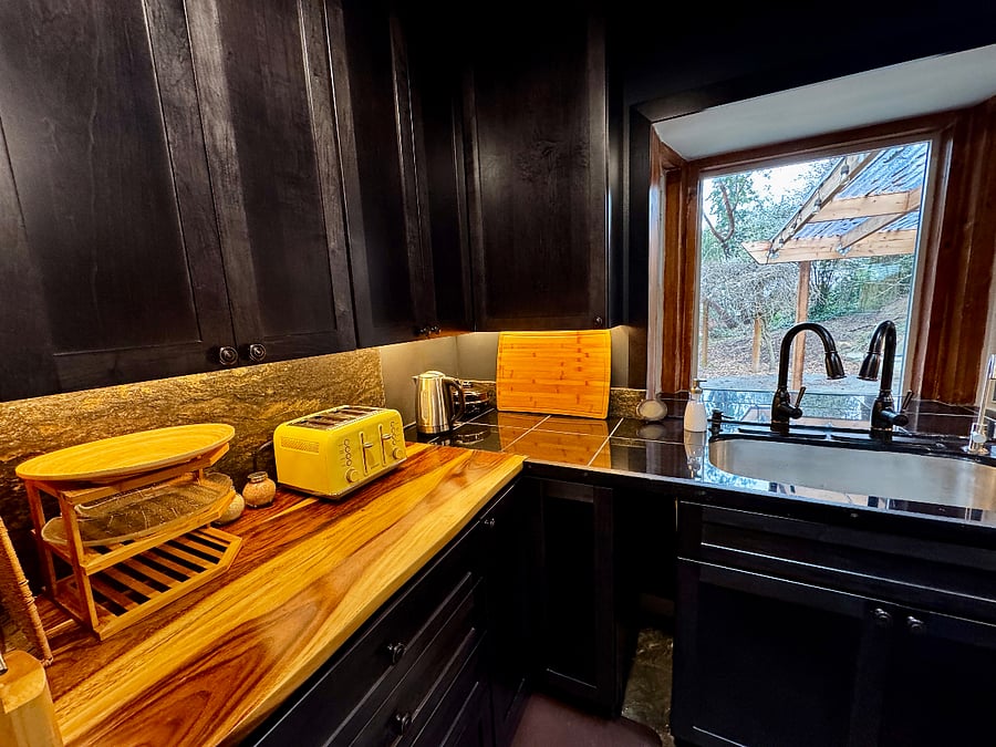 The under cabinet lighting can be made warmer or cooler by remote control.