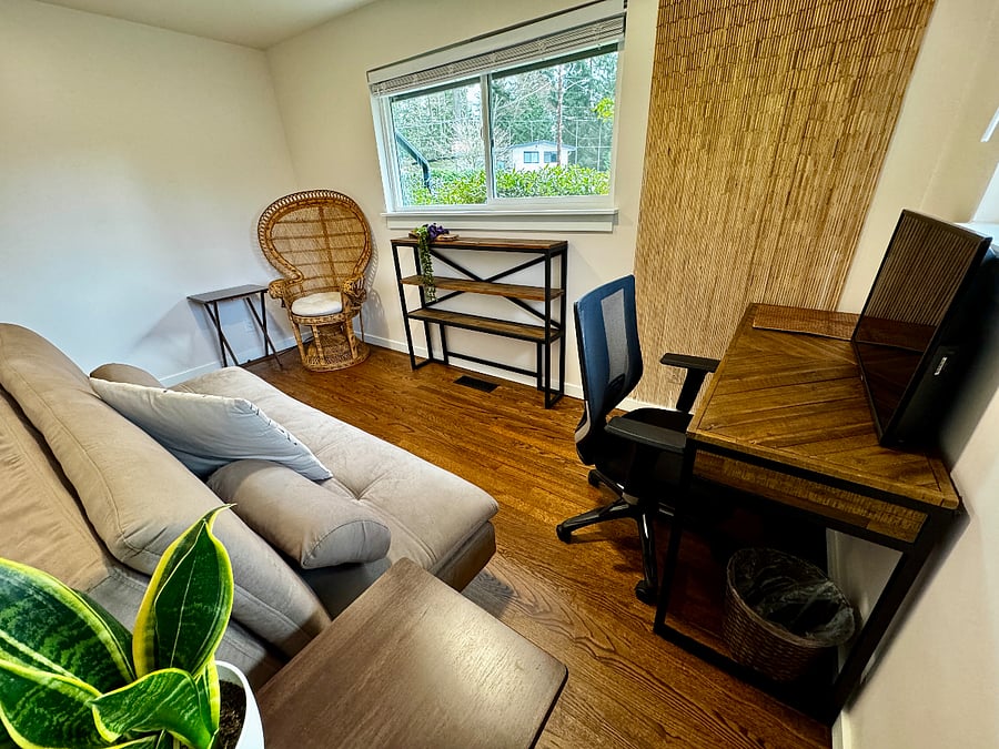 This is a dedicated office with a locking door. It has a futon couch that folds out to a full bed. Equipped with an ergonomic chair, gorgeous solid wood desk, TV/monitor with an HDMI cable, and two windows with screens and abundant southwest natural light.
