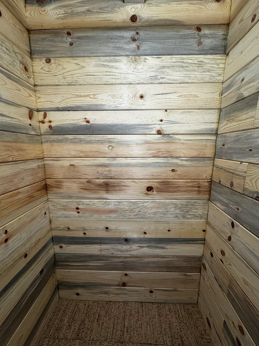 This is a meditation nook lined with beautiful wood that can also be used as a closet. Pictured both empty and with closet rod and shelving. 