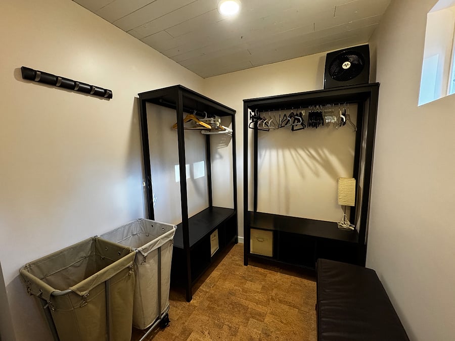 This is a gear room. This is where you will find additional hanging space for clothing, a drying rack, fire extinguisher, step stool, etc.