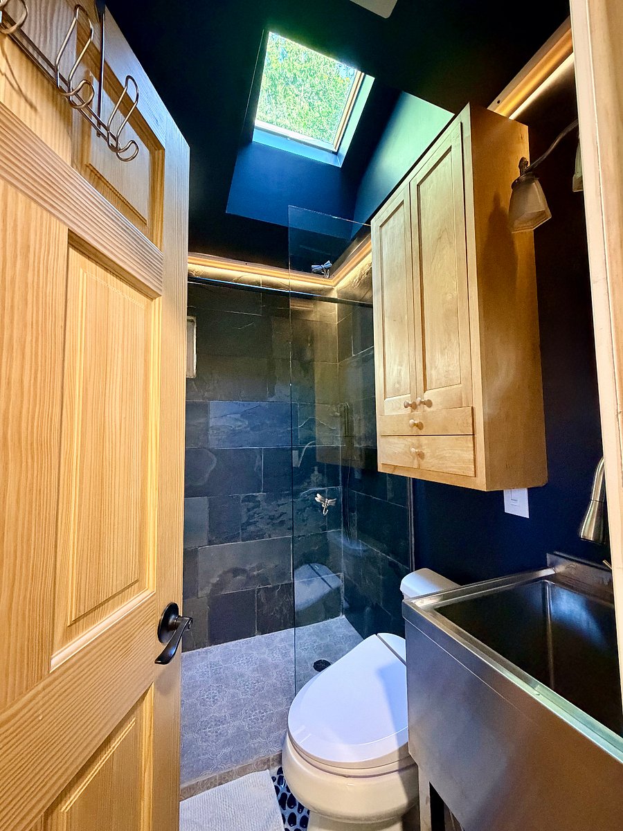 2nd bathroom with smart/bidet/heated toilet seat and slate shower with rain showerhead.